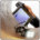 Handheld monitor displaying live feed from wheeled pipeline inspection crawler with LED lights inside a metal pipe